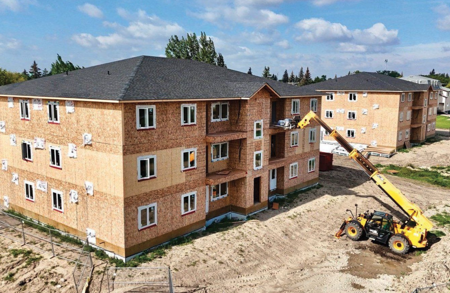 <who> Photo credit: Canadian Press/Town of Moosomin </who> Two apartment complexes are under construction in this undated photo in Moosomin, Sask.