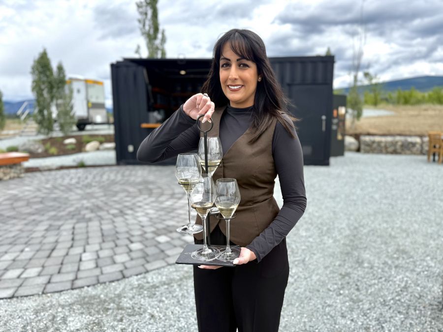 <who>Photo credits: Steve MacNaull/NowMedia Group</who>Ailm ambassador Nora Waria with the sparkling wine tree the bubblies are served on for the tasting.