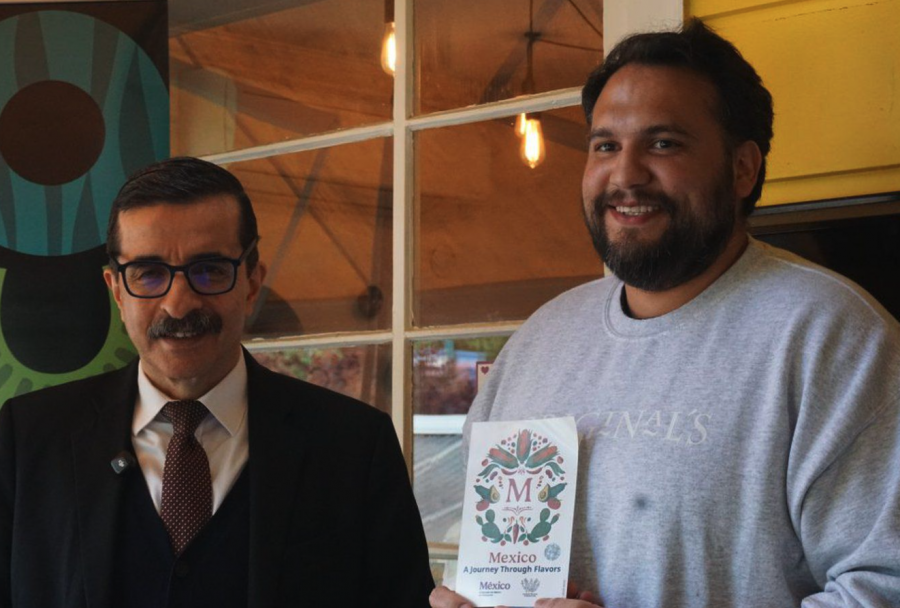 <who> Photo credit: Patrick Penner, Local Journalism Initiative Reporter </who> Mexican Consul General Julián Adem Díaz de León presenting the Sello M to Originals Mexicano’s head chef Esteban Cuevas.